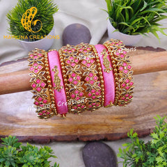 Aavani - Light Pink Bridal Silk Thread Bangles with Peacock Charms