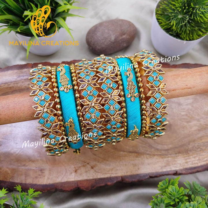 Aavani - Bridal Silk Thread Bangles with Peacock Charms