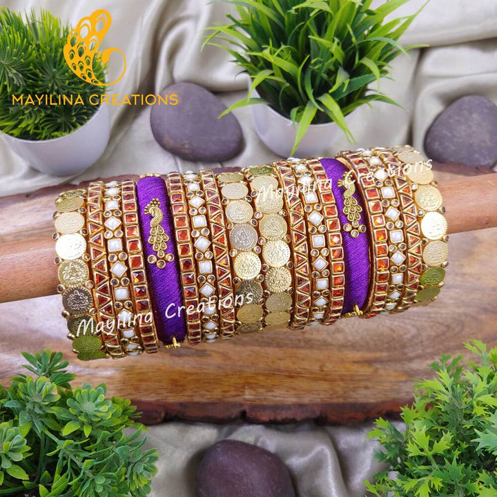 Chitra - Violet and Orange Vibrant Silk Thread Bangles with Peacock Charms for Brides