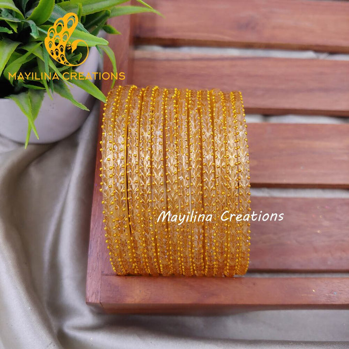 Gold Heart Cut Pattern Glass Bangles