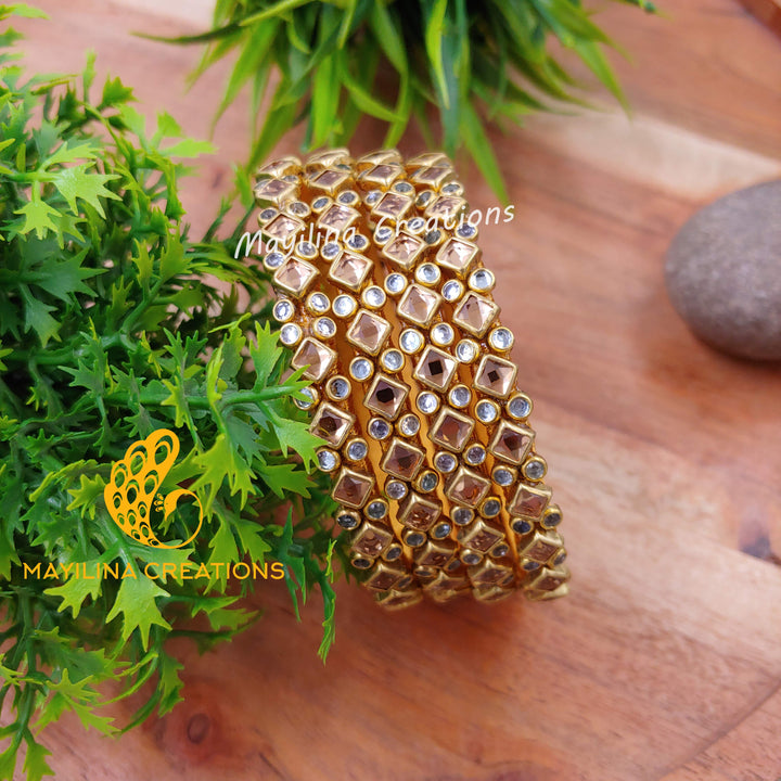 Gold Rhombus Pattern Golss with White Stone Kundan Silk Thread Bangles (Set of 4 Bangles)Multicolor