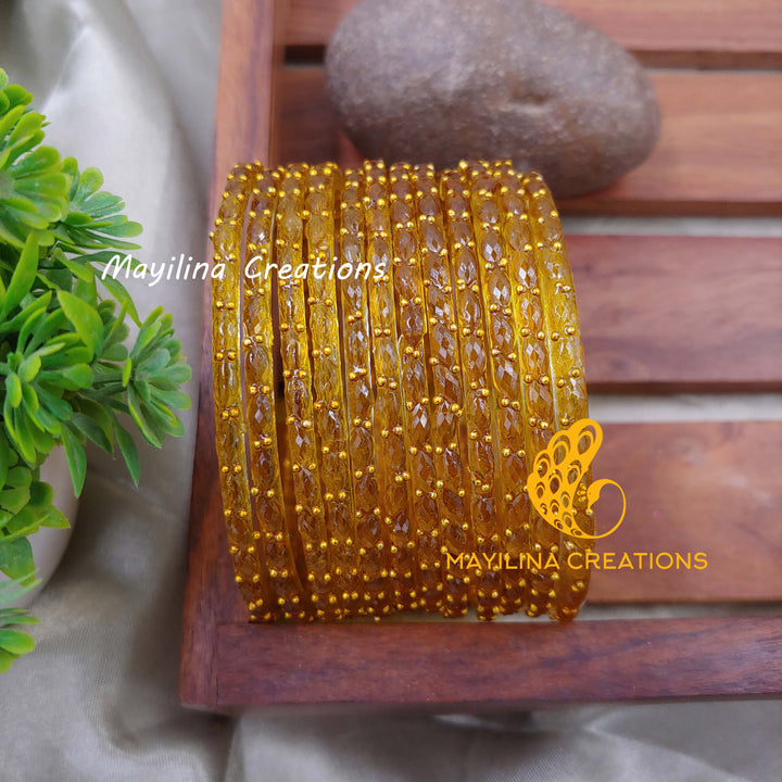 Mustard Raindrop Glass Bangles (Set of 12 Bangles)
