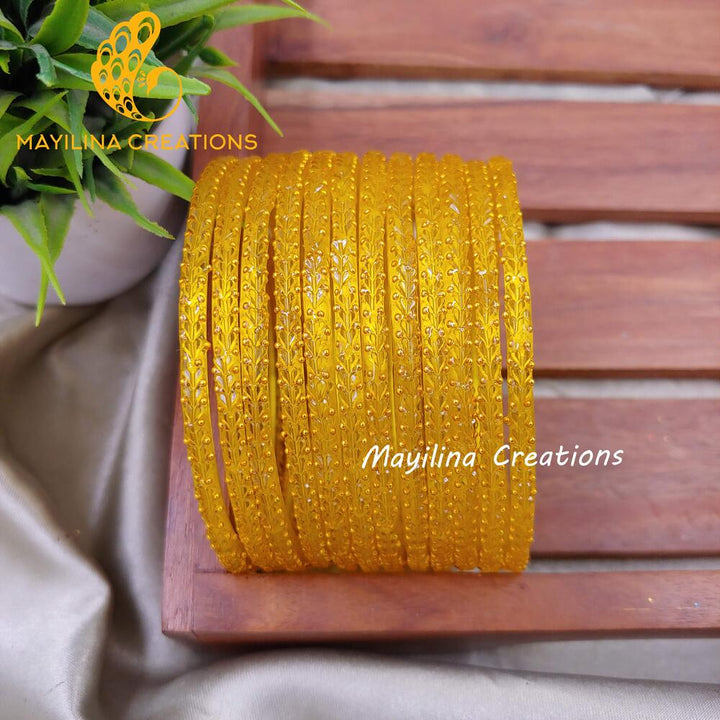 Yellow Heart Cut Pattern Glass Bangles